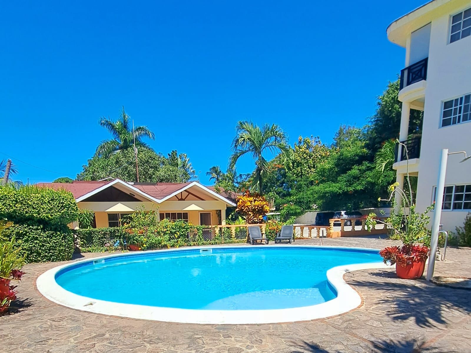 Spacious 2-bedroom apartment for sale in central Las Terrenas. Private terrace, pools, parking, and excellent rental income potential. Ideal investment in Dominican Republic.